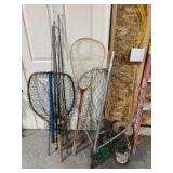 Three fishing nets and four poles two with reels