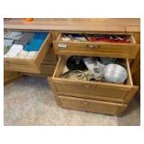 All lower cupboards - towels, cookware, utensils, flatware