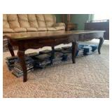 Oak coffee table with pull out trays Measures 24 wide x 56 long x16in tall