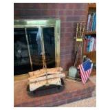 Brass fireplace tools and a metal wood log holder