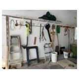 Contents on left side of the garage-Craftsman leaf blower vac, Ryobi 18 volt cordless string trimmer, clay pigeon thrower, antique nail puller, bow saw, fishing poles