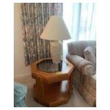 Two glass top living room tables and a table lamp Octagon table measures 26x26 and a very nice two piece glass top 26in wide x 58in long coffee table with lower shelf