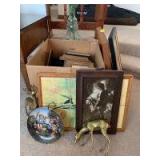 Large quantity of picture frames of all sizes, two brass deer, one knight in shining armor, a tile duck picture and a Hummel themed plate and a large glass bottle with artificial flowers