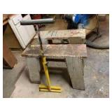 Pair of sawhorses and a folding table saw roller