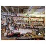 All on and above bench-screwdrivers, pliers, every nut bolt and nail in peanut butter jars under the sun, halogen work light, sanding drums, wire strippers Everything you need for your shop