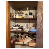 Quantity of decor items includes statues, candles, foot massager, word search books, Easter decor, wig etc Closet full!l