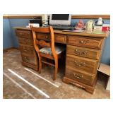 Double pedestal desk 24D x 56L x 30H and chair No contents