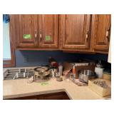 Cookbooks, cake decorating items, sifter, Corning coffee pot etc