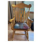Sturdy oak rocking chair, does show wear on arms Great chair for rocking grandbabies!!