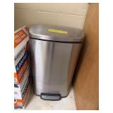 Large stainless steel foot activated lidded trash can