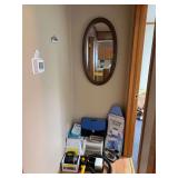 Oval wall mirror, table top ironing board, iron, plastic containers, mini vac