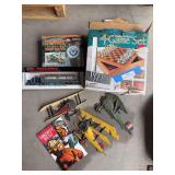 Pewter and wood game set, vintage airplane wall plaques, Lionel model semi, Smokey bear book