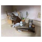 Two knife blocks, large cutting board, miscellaneous knives and kitchen Utensils
