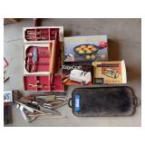 Cast-iron griddle, assortment of knives, two knife sharpeners, pancake puff maker