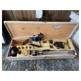 Vintage Pentax camera with tripod and accessories in wooden storage box