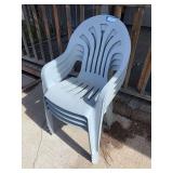 Four plastic patio chairs