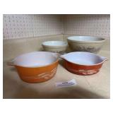 Pyrex wheat casserole dishes, and two Pyrex mixing bowls