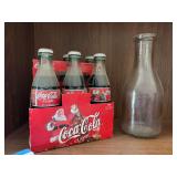 1998 edition Santa six pack glass Coke bottles plus milk bottle