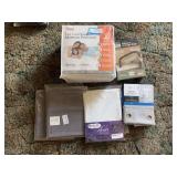 New in package mattress protector king sized, vacuum storage bags, and new linens