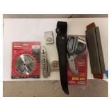 Circular saw blade, zippo lighter, combination knife, game shears, and sharpening stone