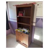 Particle board bookshelf with lower cupboard