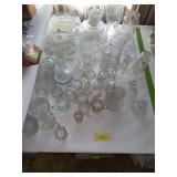 Clear glass includes cream & sugars, pitcher w matching stemware & tumblers, candle holders, snack trays and more