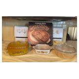 Corning Ware pizza crisper, Corning Ware casserole, Fire King casserole and Nordic Ware casserole