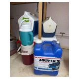 Various size coolers, water thermos and an Aquatainer