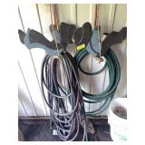 Garden hoses and swinging Amish kids wood cutouts