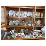 Contents of hutch includes figurines, candles, collector plates, clear glass, etc
