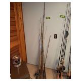 Assorted fishing poles and reels