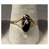 Size 8.5 diamond ring marked 10K