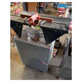 Router table on metal tool cabinet with contents
