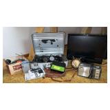 Standard rotary wall phone, weather radio, Memorex 19” tv, AM/FM transistor radio, GE electric clock, Nikon FE2 camera, Nikon FM2 camera, lenses and Cine-Kodak eight