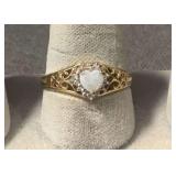Size 8.5 diamond and opal? ring marked DK 10K
