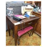 Sewing cabinet with Singer Stylist machine 6544, bench seat and jar w buttons