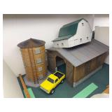 Antique looking silo and stone foundation barn plastic