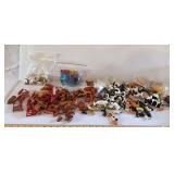 Two plastic containers of farm animals, implements, and accessories as shown