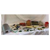 Assorted plastic buildings and 1/64th scale farm toys