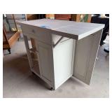 Rolling wooden kitchen island made into portable serving cart with chalkboard front