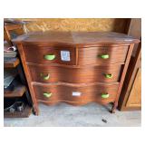 Four drawer serpentine front dresser with ribbon for drawer pulls