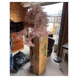 Large artificial Christmas tree and pink artificial Christmas  tree
