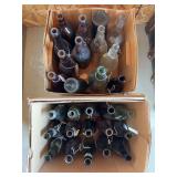 Two boxes full of vintage glass bottles