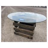 Antique wooden crate with round glass top