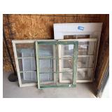Four antique windows - the one in the back is the entire frame, including original weight system