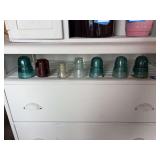 Seven glass insulators