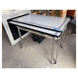 Vintage chrome leg enamel top table with two self storing leaves