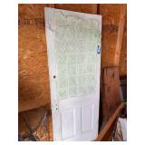 Antique wood door with ceiling tin and a hook