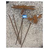Rusted metal garden art, dragonfly, and Bee