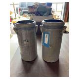 Two tall cylinder style gray crocks